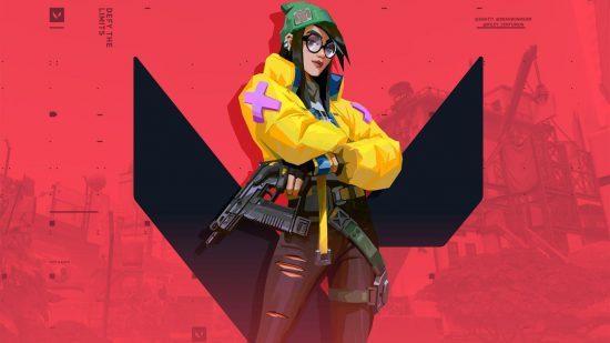 Valorant tier list: Killjoy, an s-tier agent, with her arms folded, wearing a bright-yellow puffer jacket in front of the Valorant 'V' symbol.